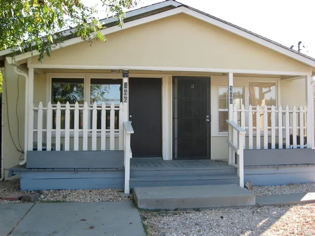 a front view of a house with a porch