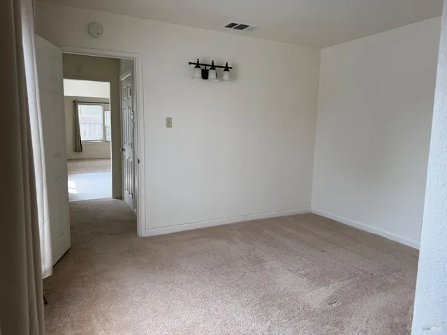 an empty room with a hallway