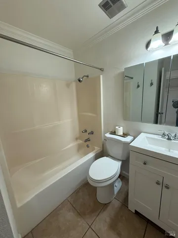 a bathroom with a sink toilet a mirror and shower