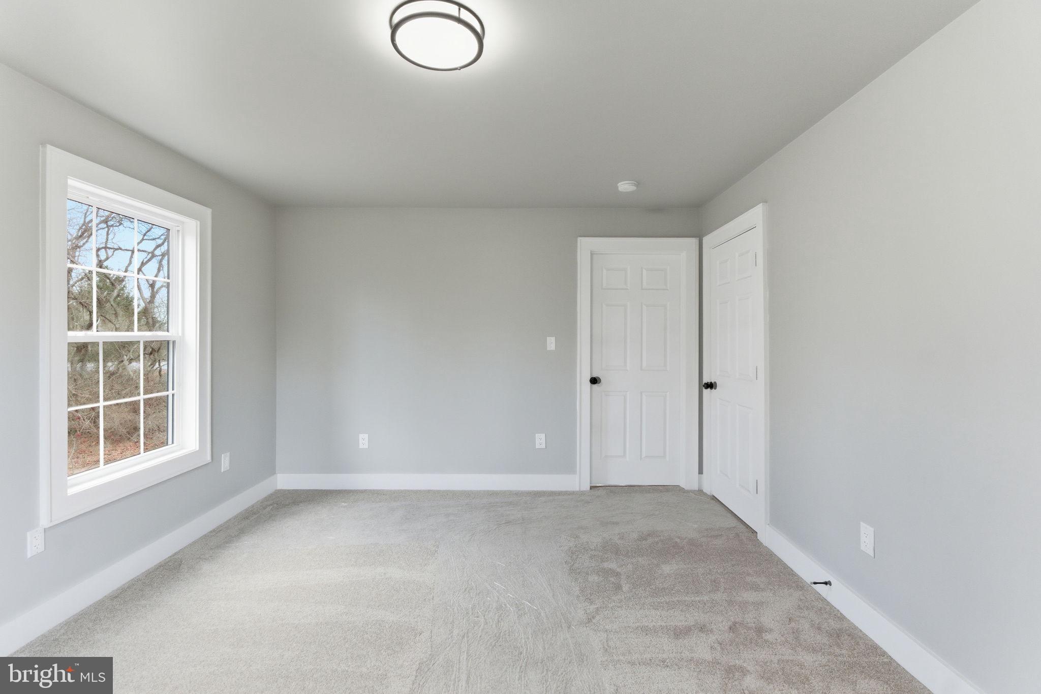 14 Anderson Court Berkeley Springs, WV 25411 - Photo 16 of 52 a view of an empty room with a window