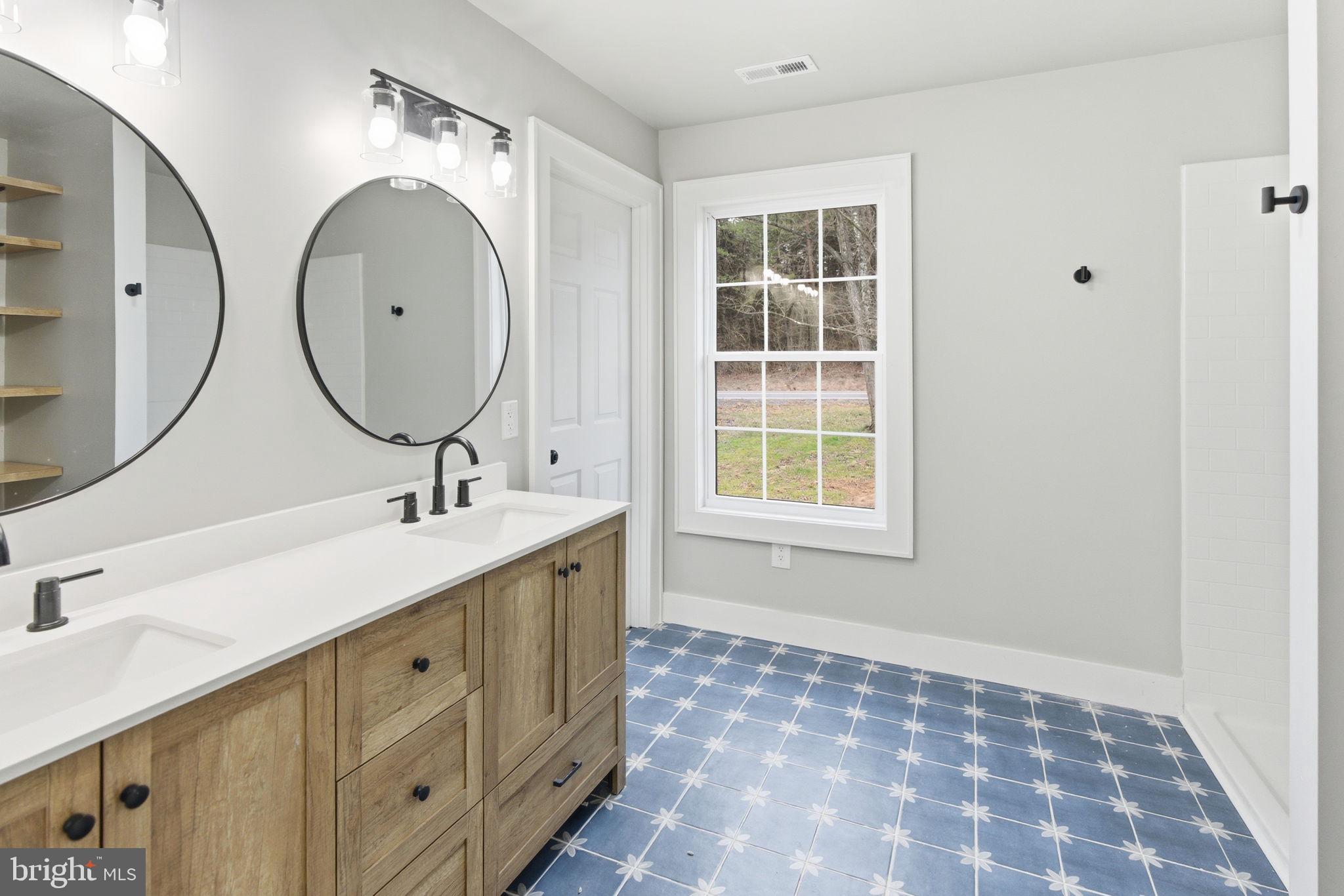 14 Anderson Court Berkeley Springs, WV 25411 - Photo 17 of 52 a bathroom with a sink and a mirror