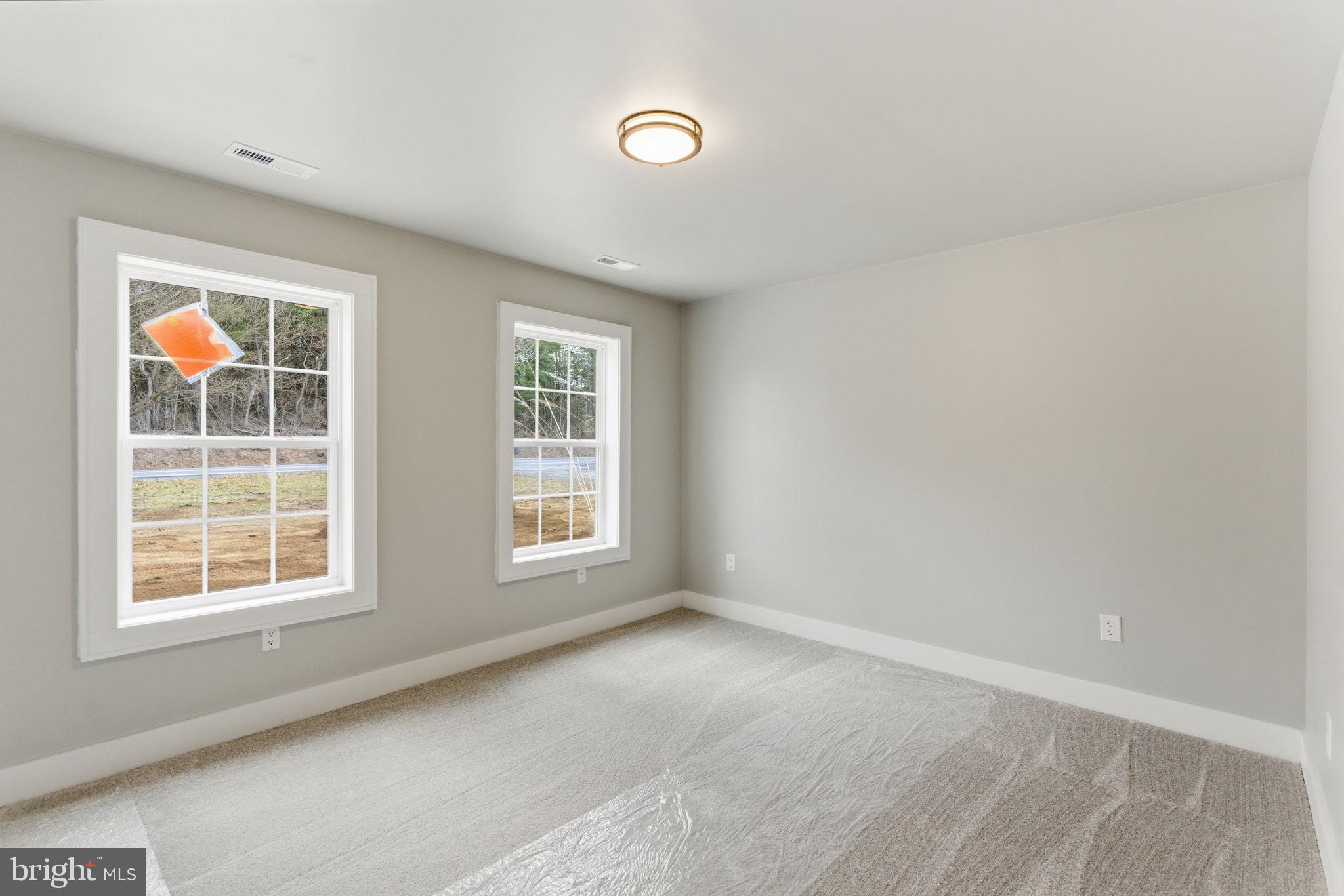 14 Anderson Court Berkeley Springs, WV 25411 - Photo 20 of 52 an empty room with windows
