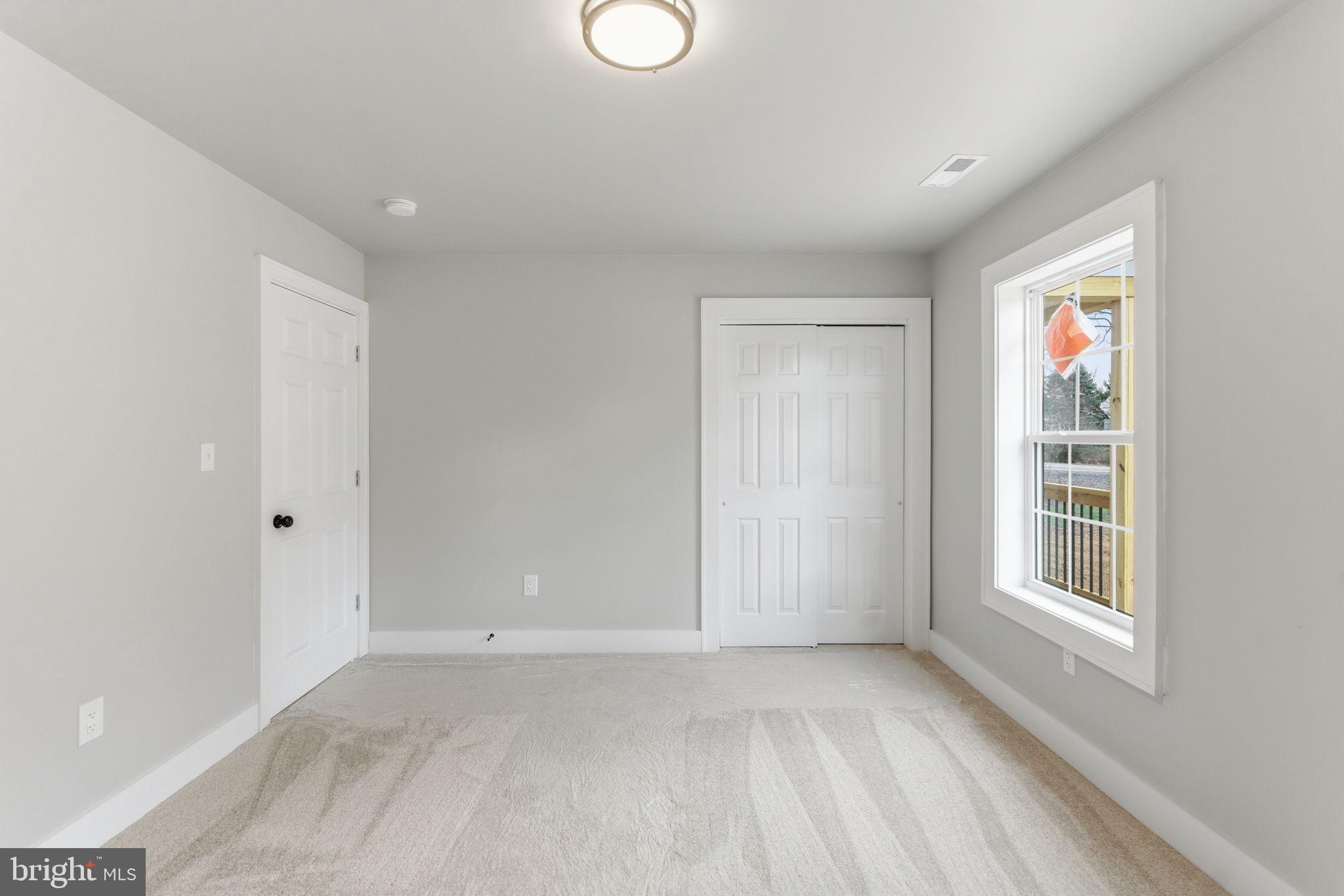 14 Anderson Court Berkeley Springs, WV 25411 - Photo 22 of 52 a view of an empty room with a window