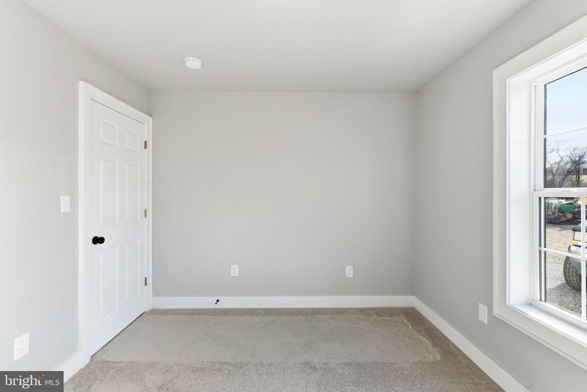 14 Anderson Court Berkeley Springs, WV 25411 - Photo 26 of 52 an empty room with windows