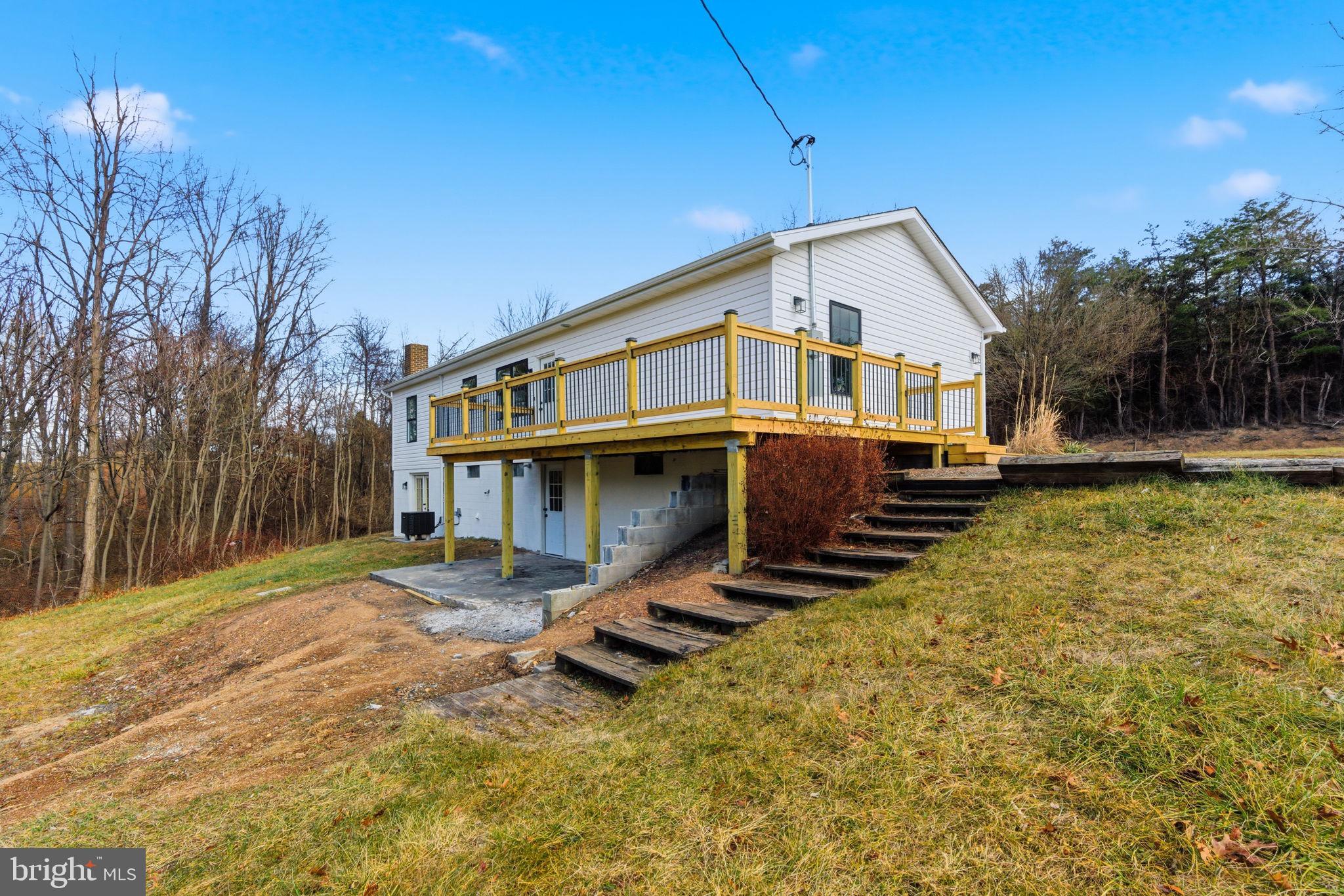 14 Anderson Court Berkeley Springs, WV 25411 - Photo 37 of 52 a view of a house with wooden floor next to a yard