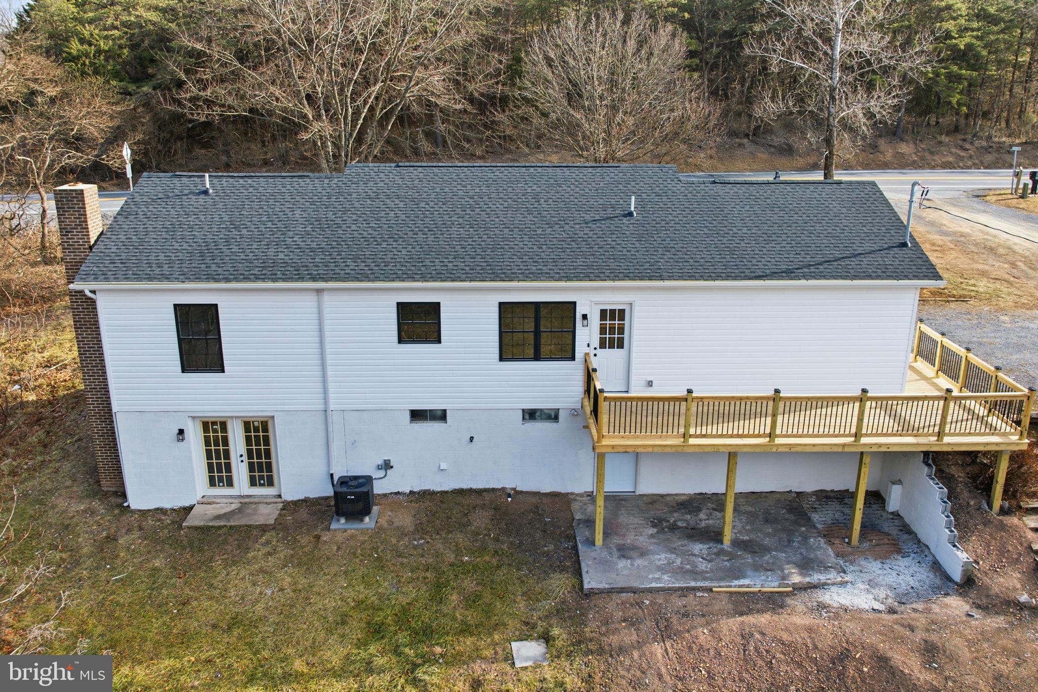 14 Anderson Court Berkeley Springs, WV 25411 - Photo 48 of 52 a backyard of a house with table and chairs