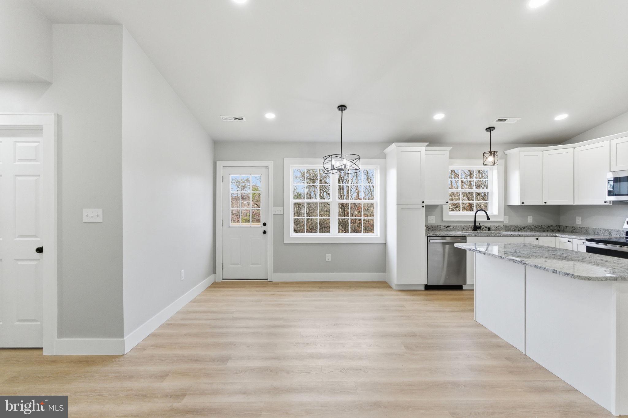 14 Anderson Court Berkeley Springs, WV 25411 - Photo 9 of 52 a view of large kitchen with granite countertop kitchen island a sink stainless steel appliances and cabinets