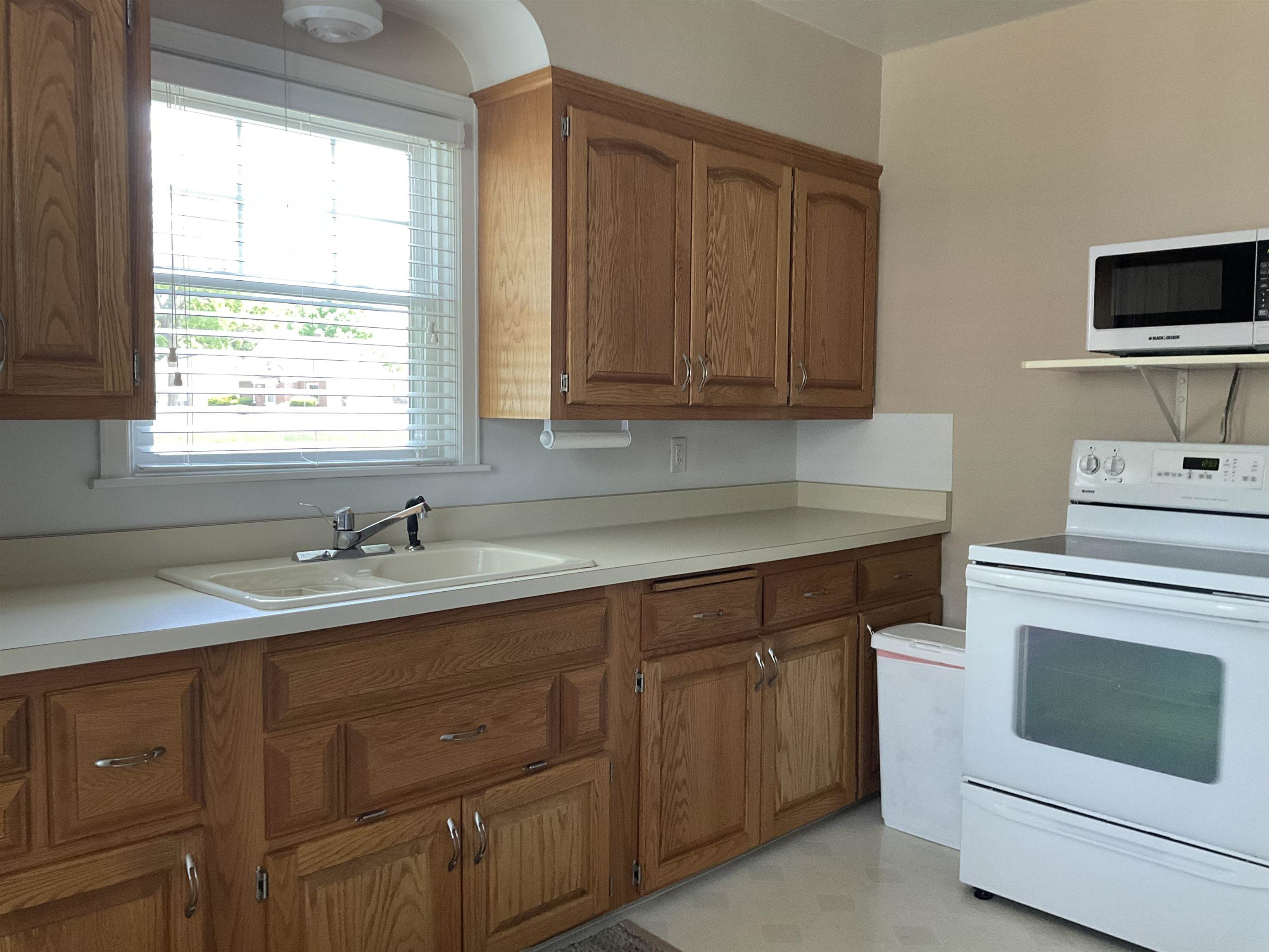3330 California Road Rockford, IL 61108 - Photo 11 of 29 a kitchen with sink cabinets and window