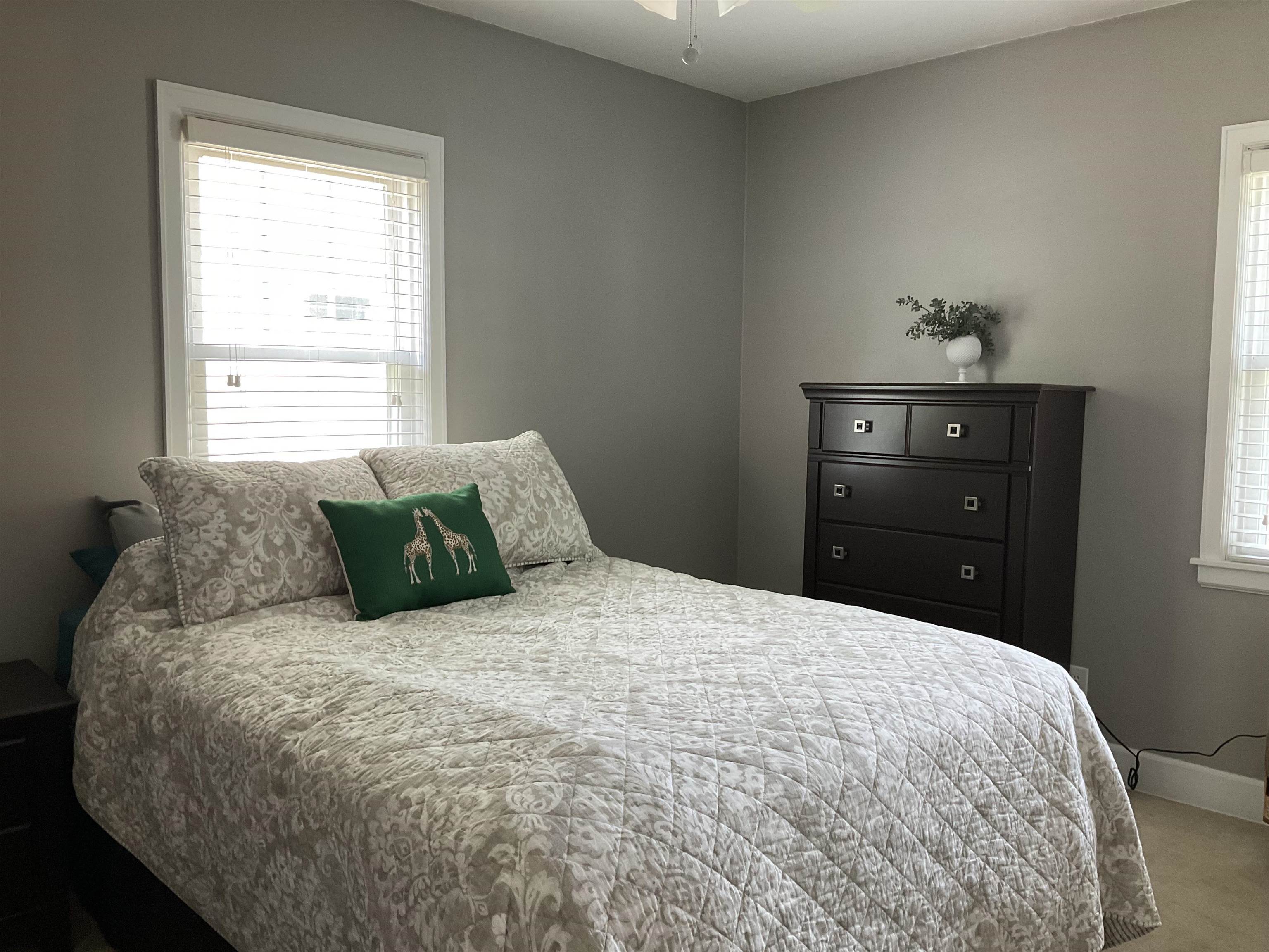 3330 California Road Rockford, IL 61108 - Photo 13 of 29 a bed sitting in a bedroom next to a window