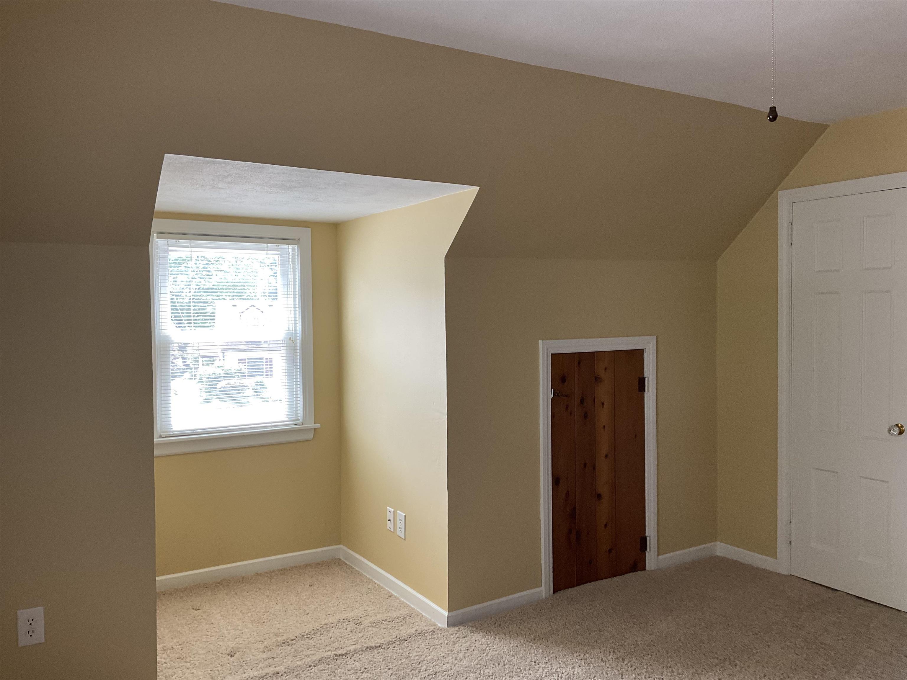 3330 California Road Rockford, IL 61108 - Photo 17 of 29 a view of an empty room with wooden floor and a window