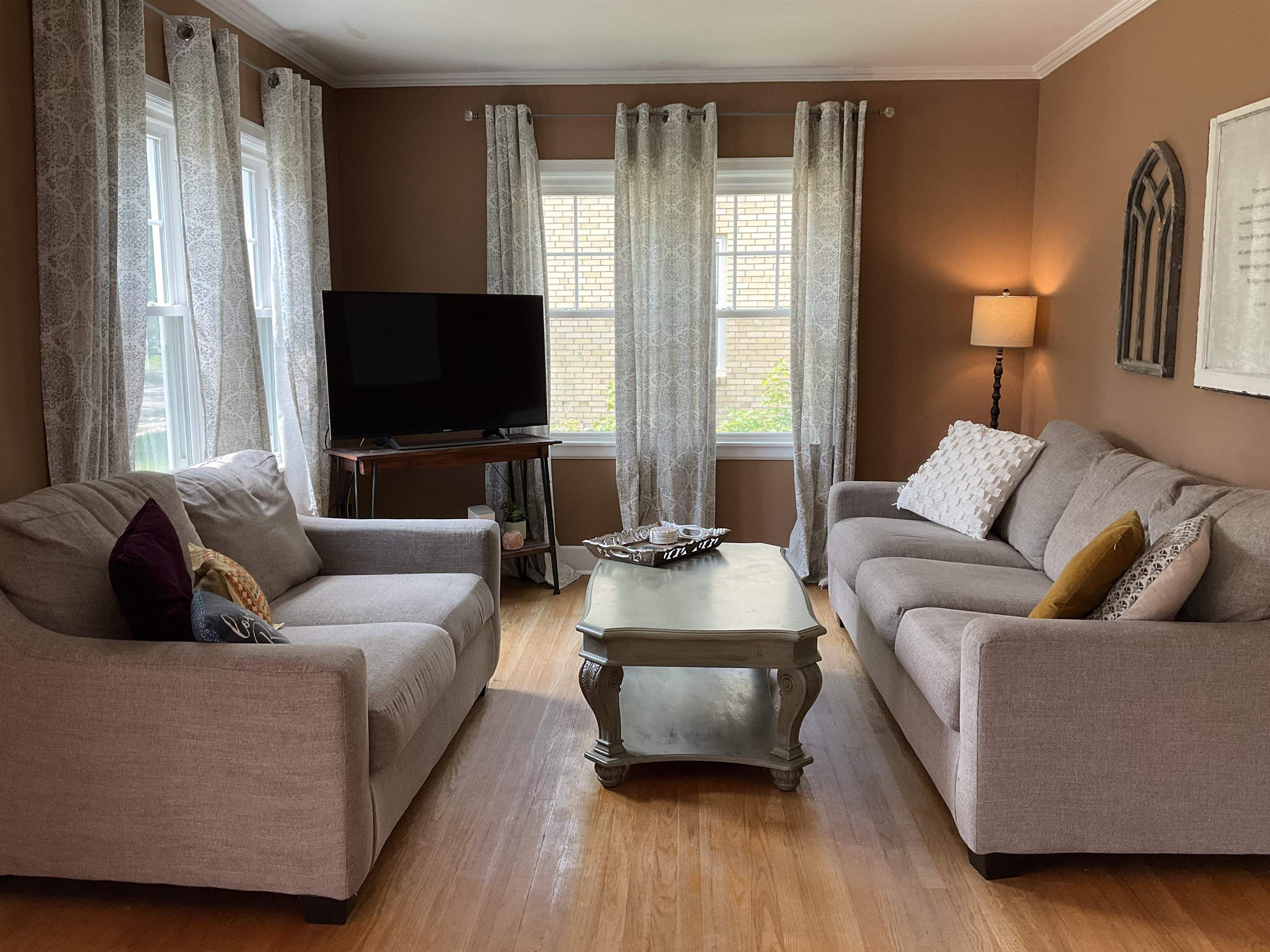 3330 California Road Rockford, IL 61108 - Photo 3 of 29 a living room with furniture and a flat screen tv