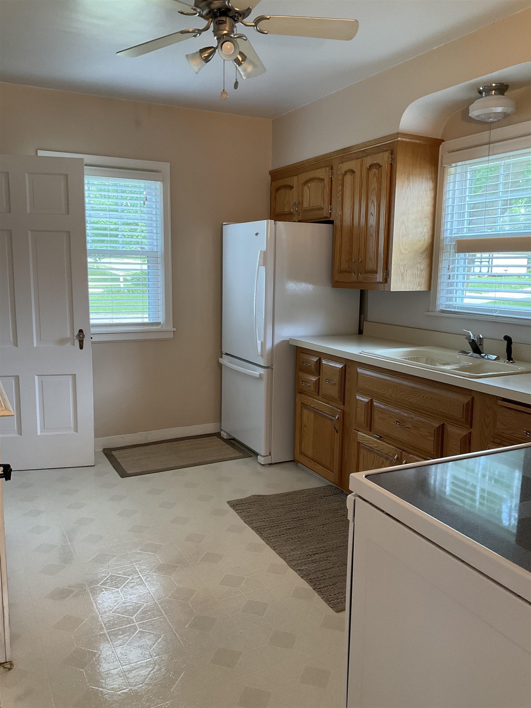 3330 California Road Rockford, IL 61108 - Photo 8 of 29 a kitchen with stainless steel appliances granite countertop a sink stove and refrigerator