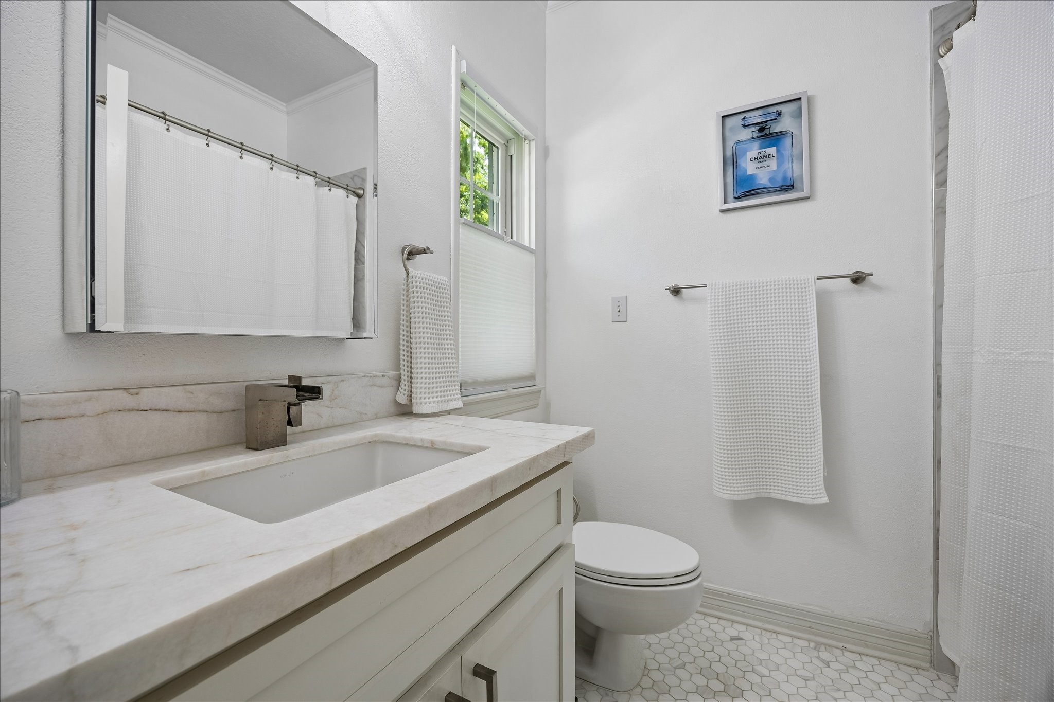 4131 Sunset Boulevard Houston, TX 77005 - Photo 29 of 38 a bathroom with a sink a toilet and shower