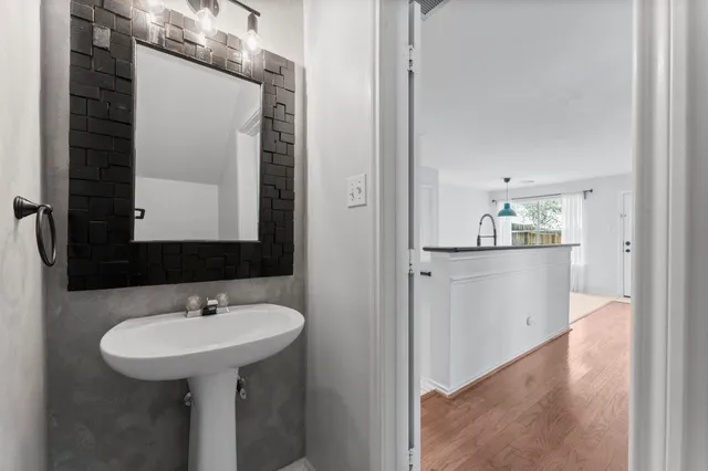 a bathroom with a sink and a mirror