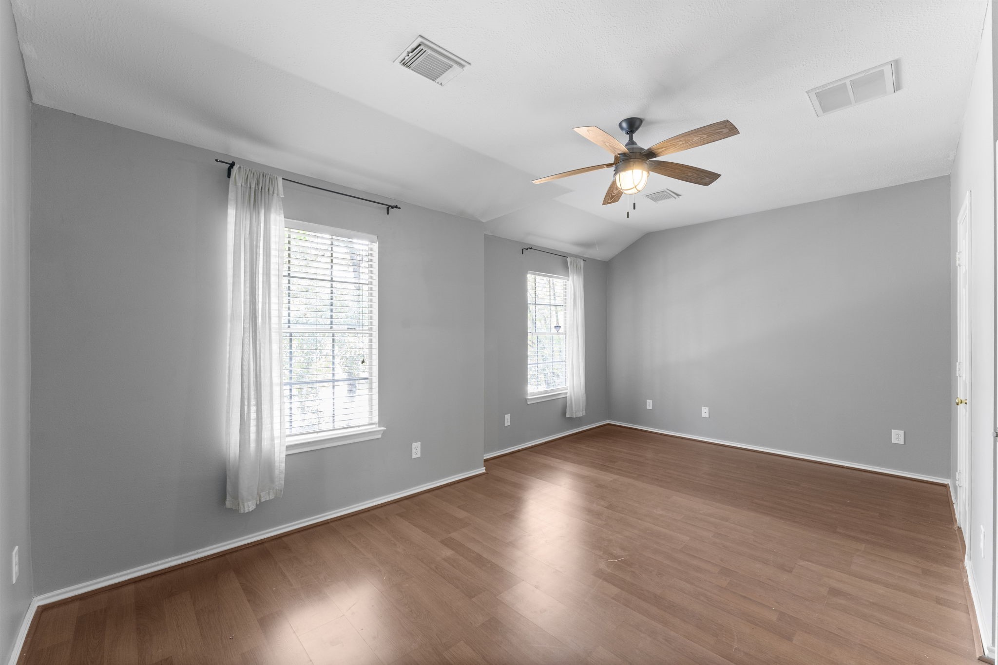 15 Timberstar Street Spring, TX 77382 - Photo 13 of 21 wooden floor in an empty room with a window