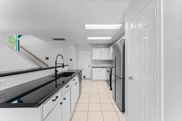 a view of a kitchen cabinets and a counter place