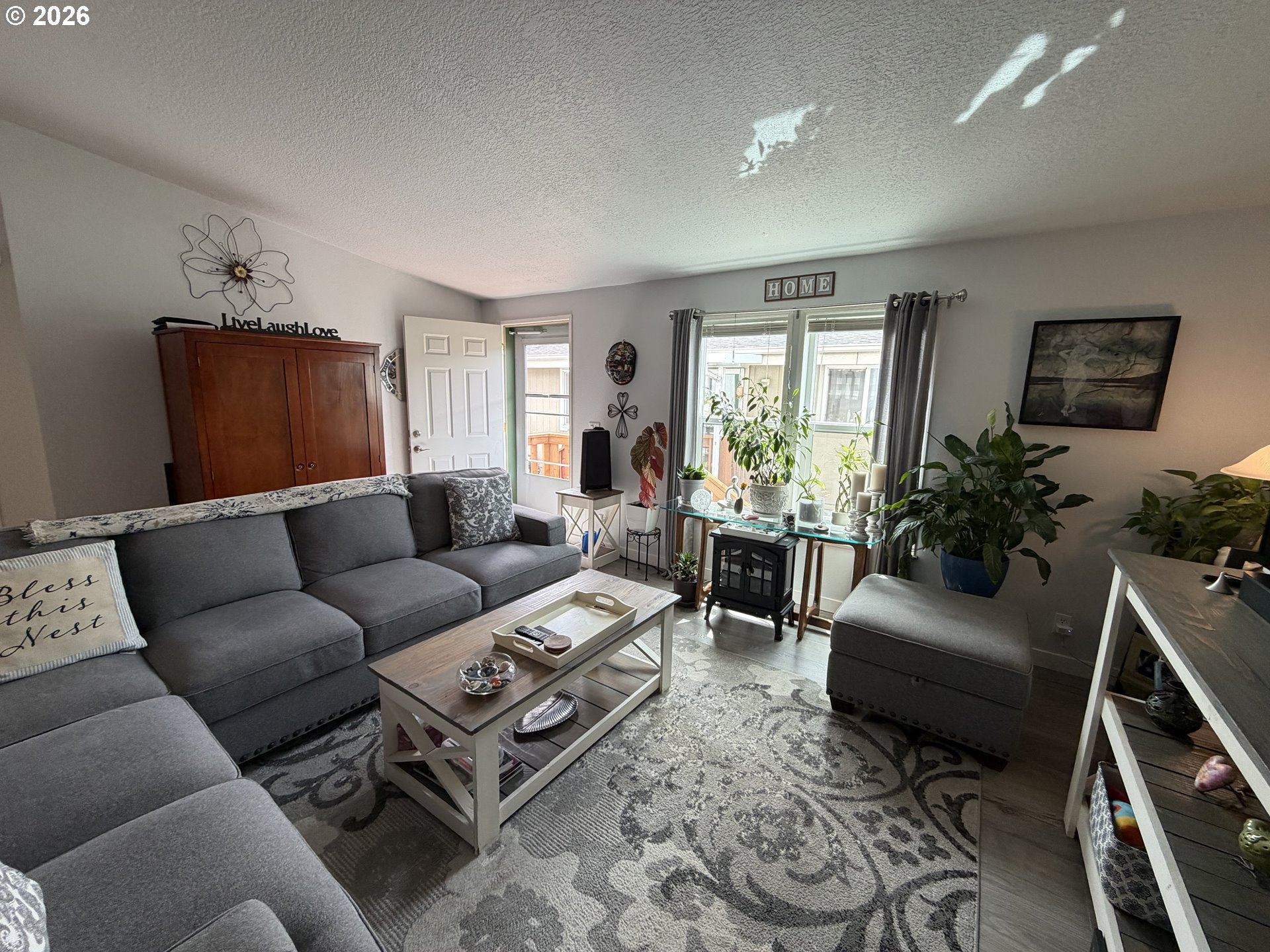 1699 North Terry Street, Unit 351 Eugene, OR 97402 - Photo 6 of 23 a living room with furniture rug and window