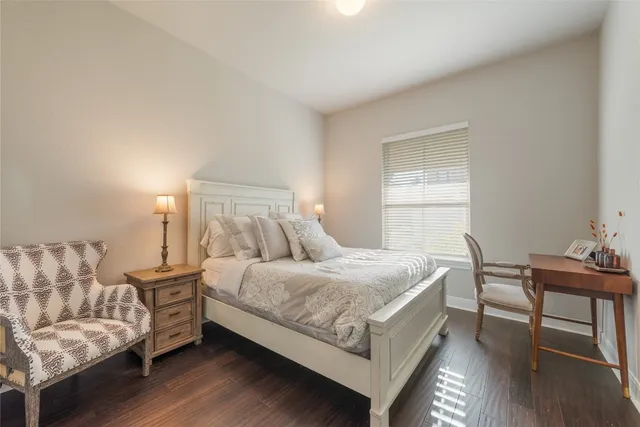 a bedroom with a bed and a table