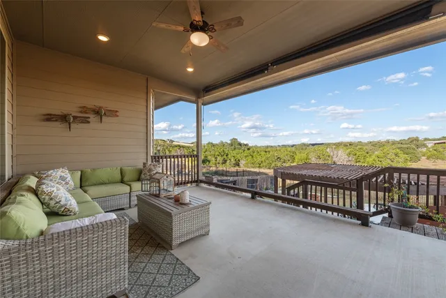 a balcony with furniture and outdoor seating