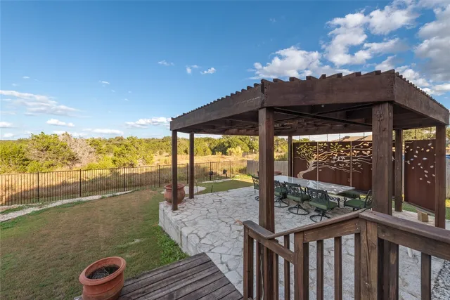 a view of a balcony with chair and table