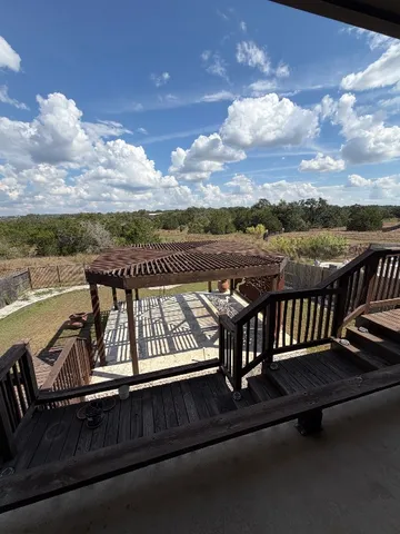 a view of a roof deck with lake view and mountain view