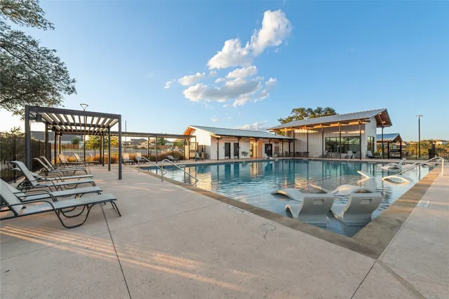 a view of a lake with couches chairs