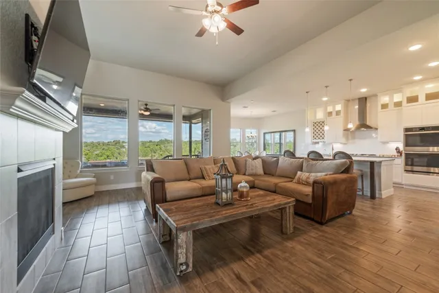 a living room with furniture and a large window