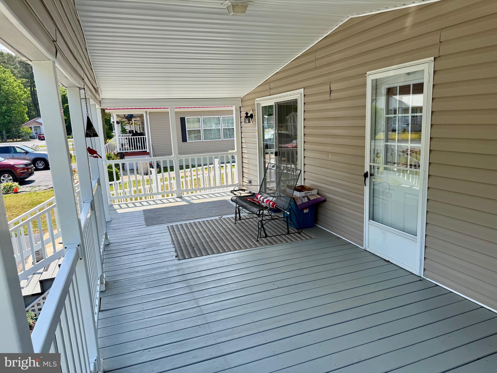821 Rum Bridge Branch Road Seaford, DE 19973 - Photo 12 of 15 a view of a porch with wooden floor and furniture