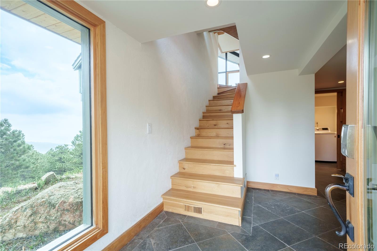 926 Brook Road Boulder, CO 80302 - Photo 6 of 50 a view of entryway and hall with wooden floor