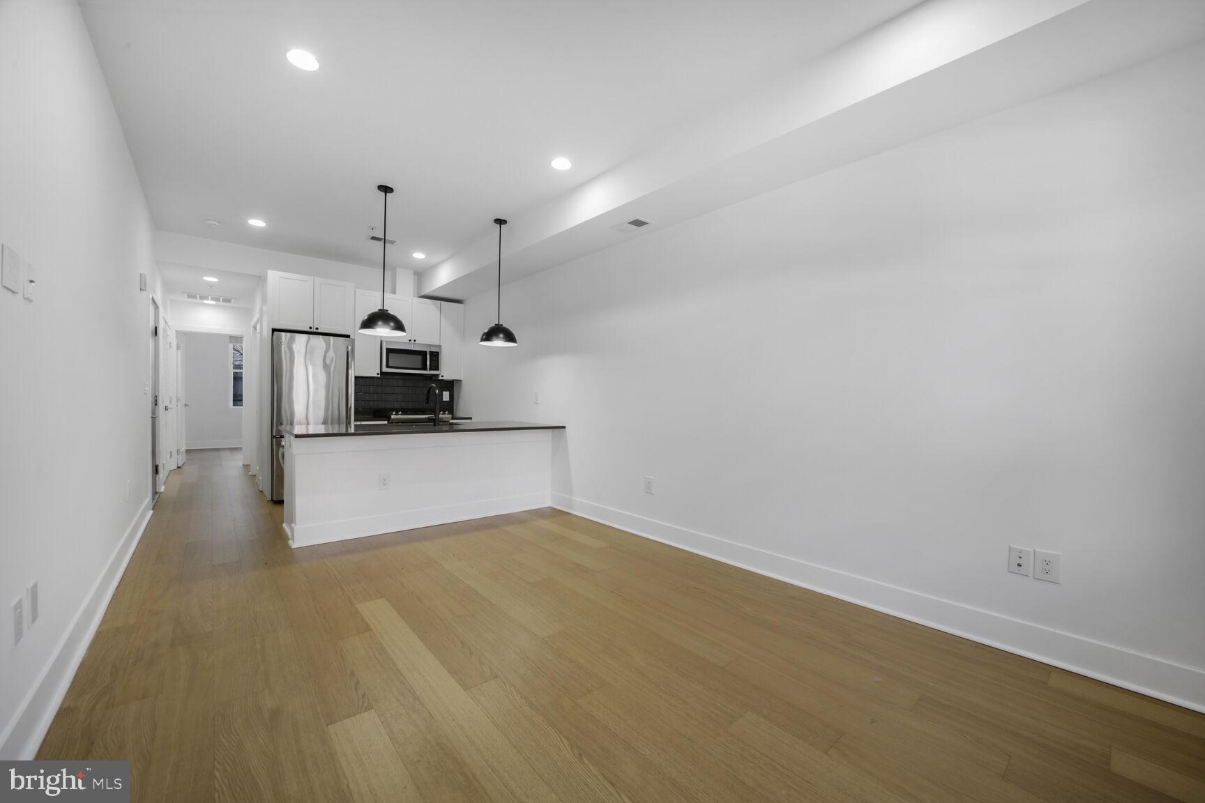 11 15th Street Northeast, Unit 3 Washington, DC 20002 - Photo 3 of 16 Living Room/Kitchen