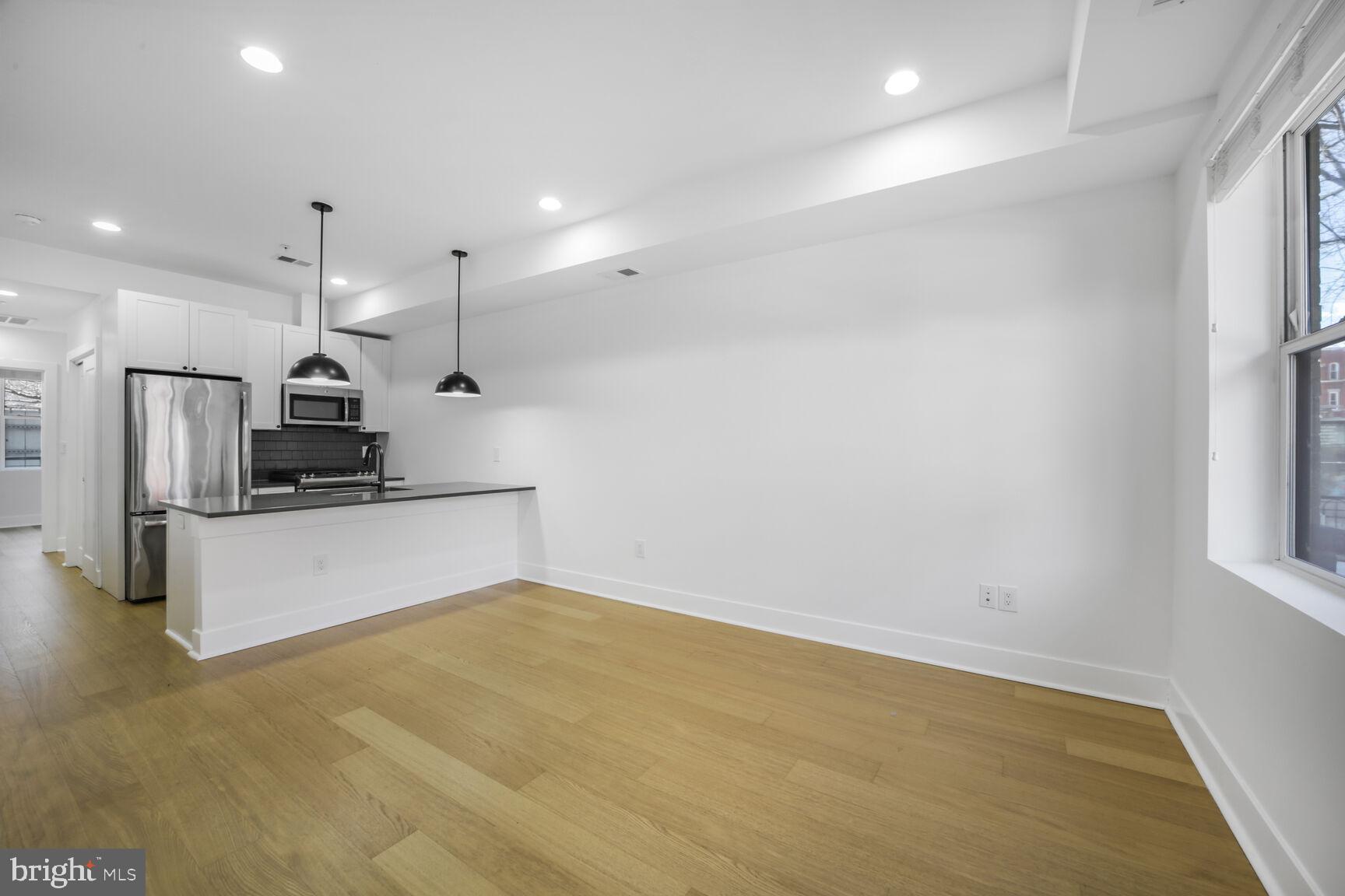 11 15th Street Northeast, Unit 3 Washington, DC 20002 - Photo 8 of 16 Living Room/Kitchen