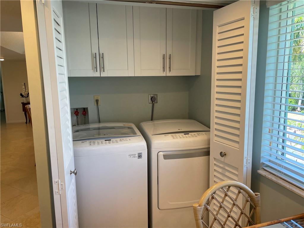 261 Quails Nest Road, Unit 6 Naples, FL 34112 - Photo 15 of 32 a utility room with dryer and washer
