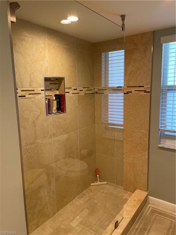 261 Quails Nest Road, Unit 6 Naples, FL 34112 - Photo 27 of 32 a bathroom with a sink and a shower