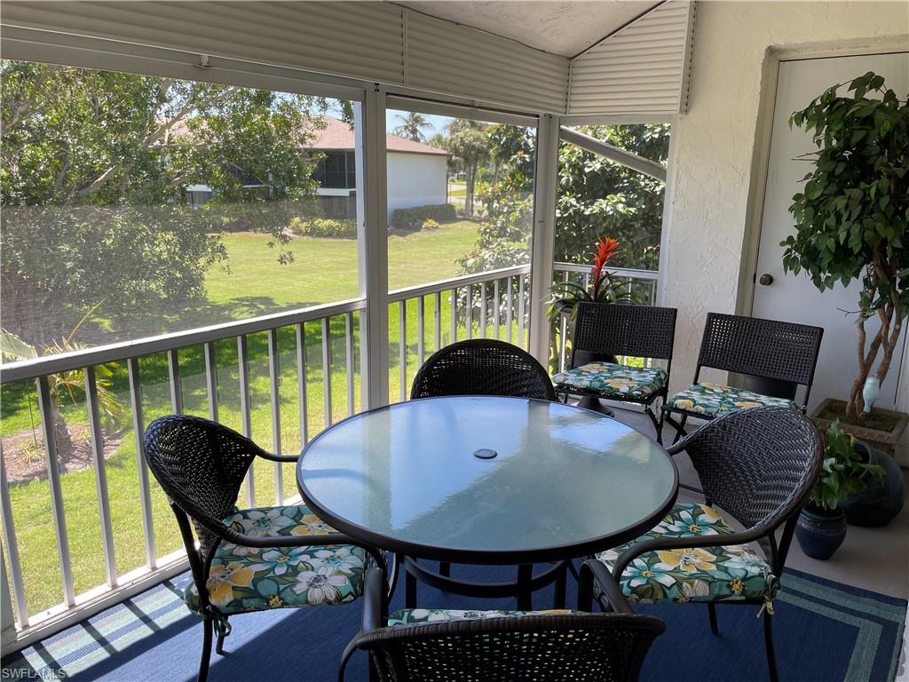 261 Quails Nest Road, Unit 6 Naples, FL 34112 - Photo 6 of 32 a view of a dining room with furniture window and outside view