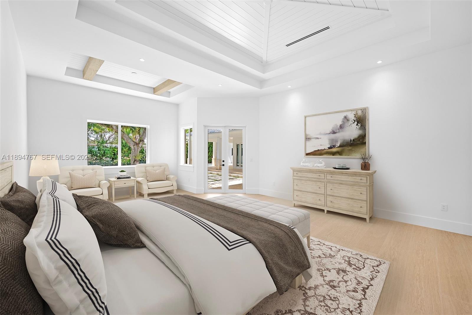 7900 Southwest 118th Street Pinecrest, FL 33156 - Photo 13 of 41 a bedroom with a bed and wooden floor