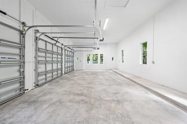 a view of a house with a yard deck and a patio