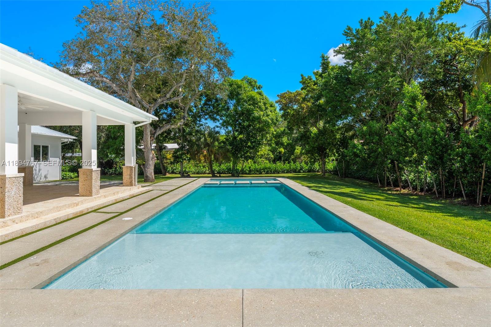 7900 Southwest 118th Street Pinecrest, FL 33156 - Photo 33 of 41 a view of outdoor space yard swimming pool and porch