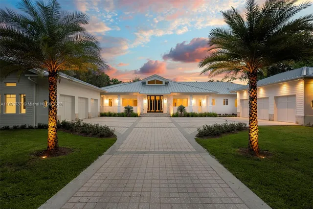 a view of swimming pool with lawn chairs and a yard