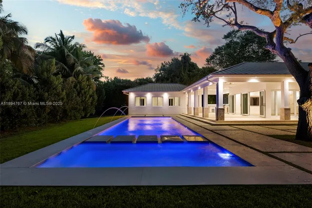 a view of swimming pool with outdoor seating