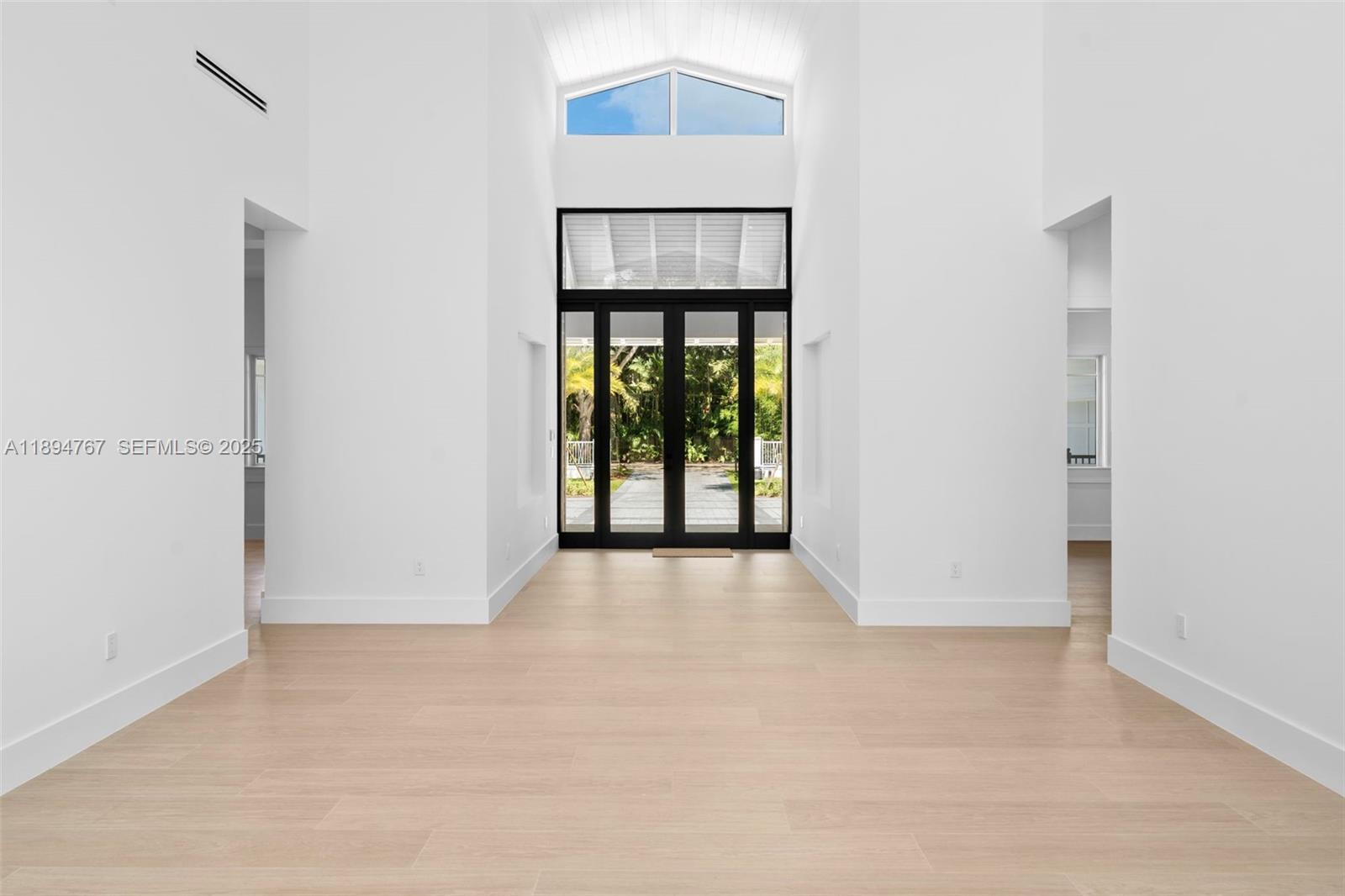 7900 Southwest 118th Street Pinecrest, FL 33156 - Photo 4 of 41 a view of an empty room with a window