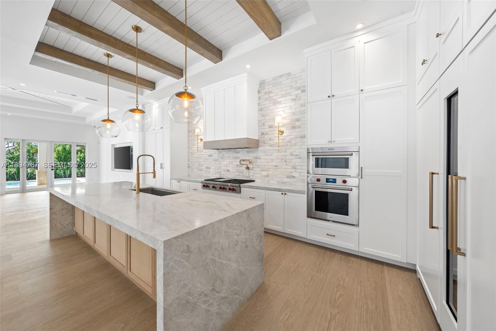 7900 Southwest 118th Street Pinecrest, FL 33156 - Photo 6 of 41 a kitchen with a sink stove and refrigerator