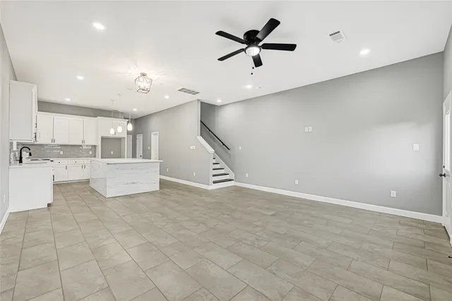 a view of a kitchen with a sink and dishwasher in kitchen