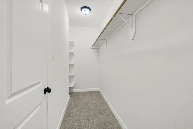a view of kitchen with sink and microwave