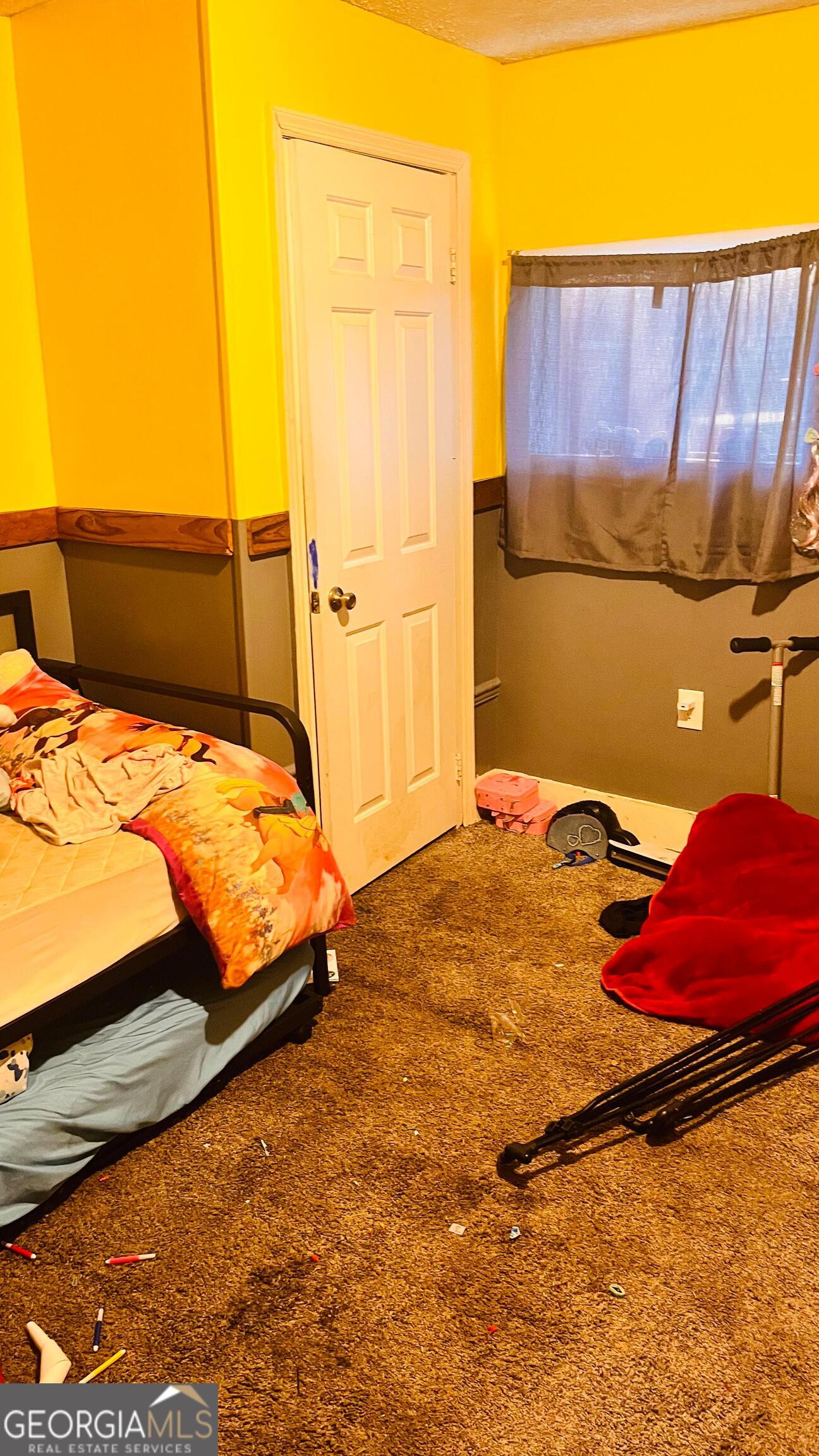 412 Magnolia Street LaFayette, GA 30728 - Photo 12 of 19 a bedroom with a bed and a couch