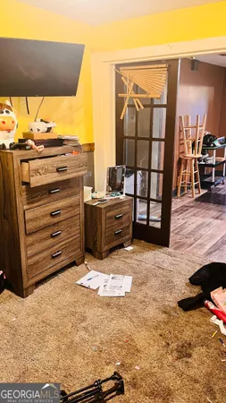 a view of room with wooden floor and window