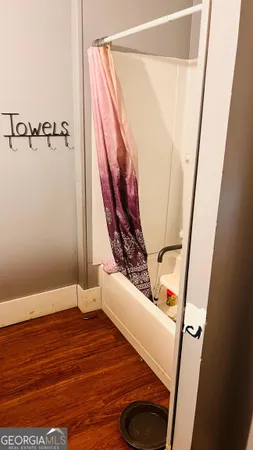 a view of an entryway with wooden floor