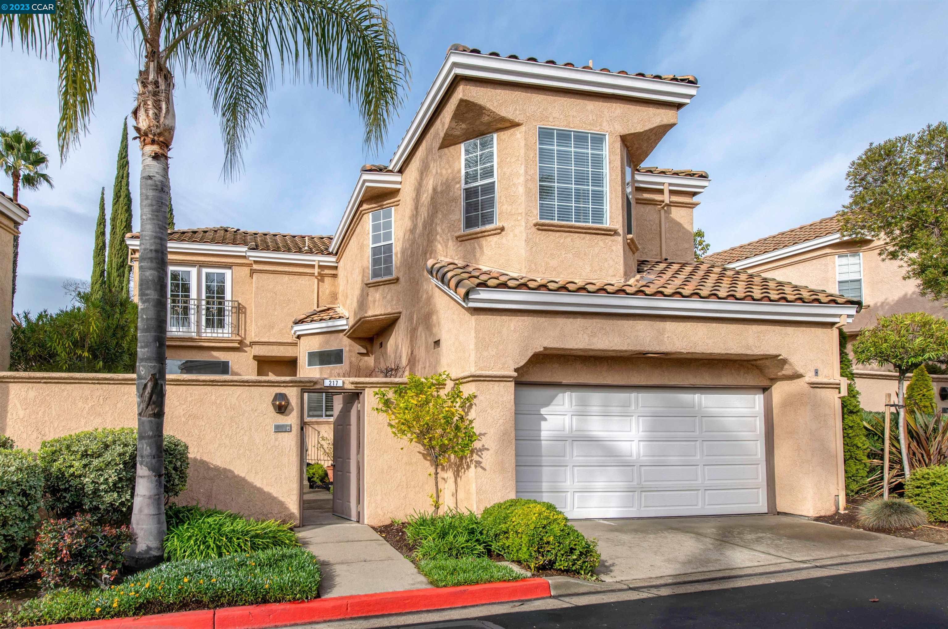 217 Majorca Drive San Ramon, CA 94582 - Photo 1 of 1 a front view of a house with a yard and garage