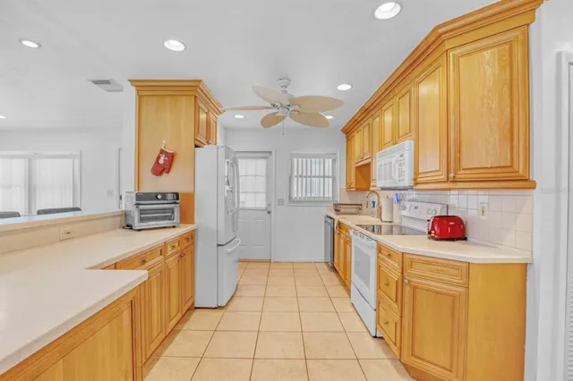 a kitchen with a cabinets and appliances