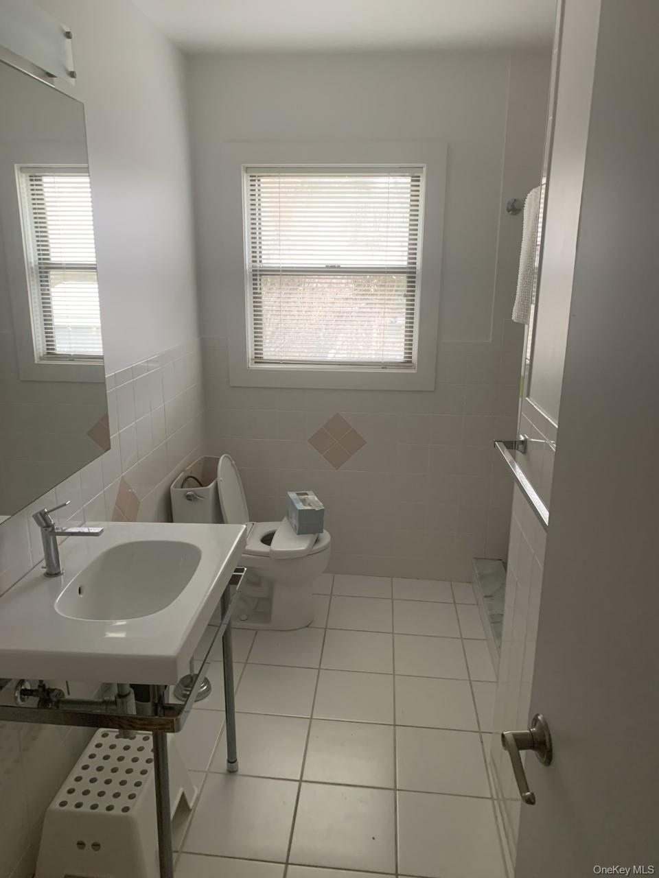 35 Sloop Walk Ocean Beach, NY 11770 - Photo 16 of 21 a bathroom with a sink a toilet and a window