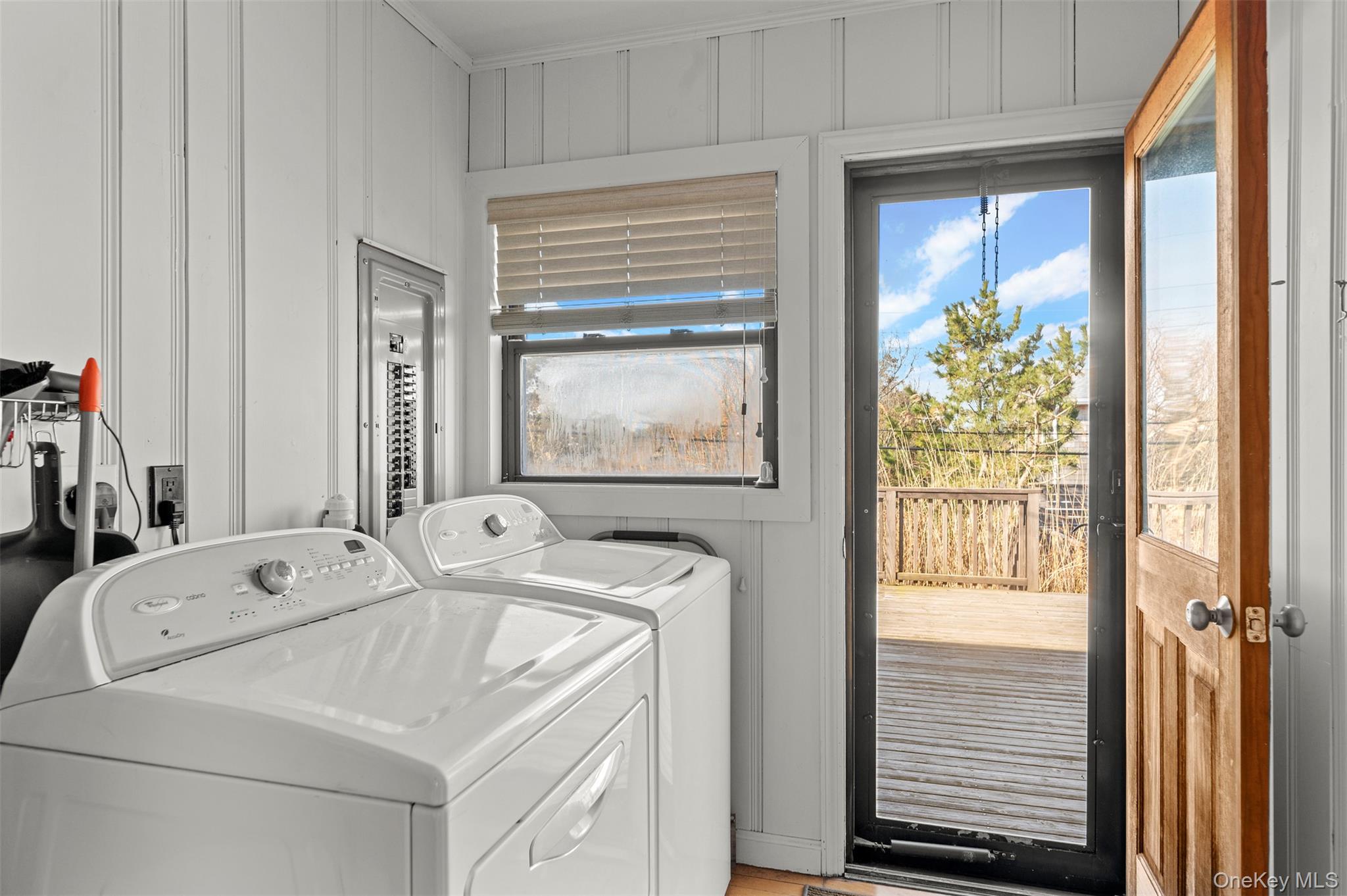 35 Sloop Walk Ocean Beach, NY 11770 - Photo 18 of 21 Washroom with washer and clothes dryer and wood walls